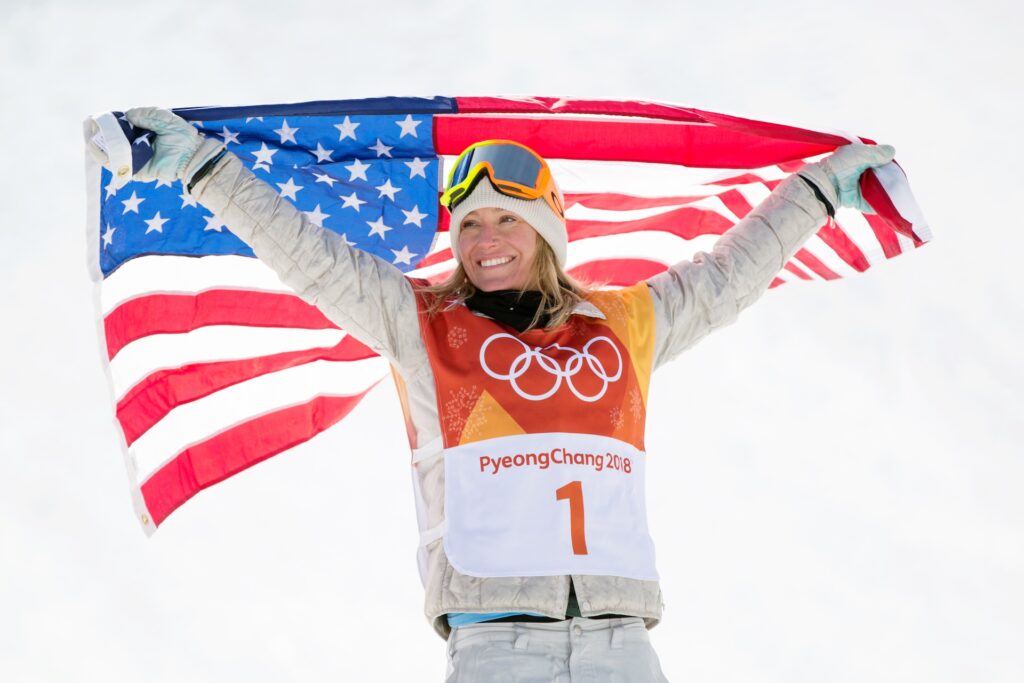 Olympic champion celebrating with the US flag